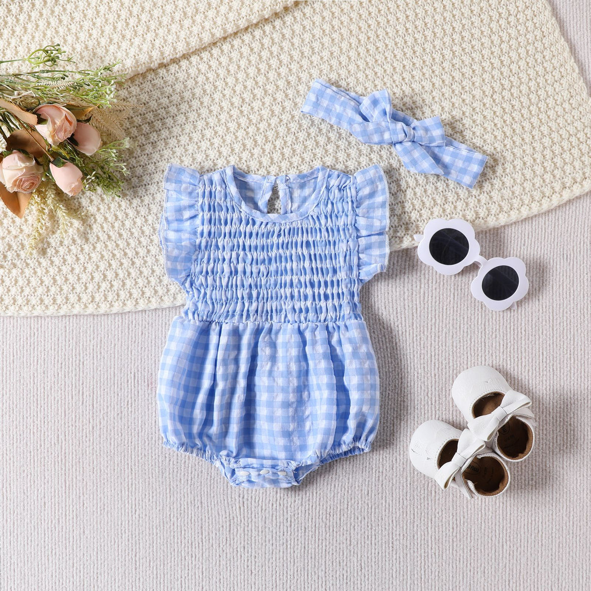 Cozy Cub baby girl sleeveless romper in solid blue with triangle pattern, made for comfortable wear and easy dressing.