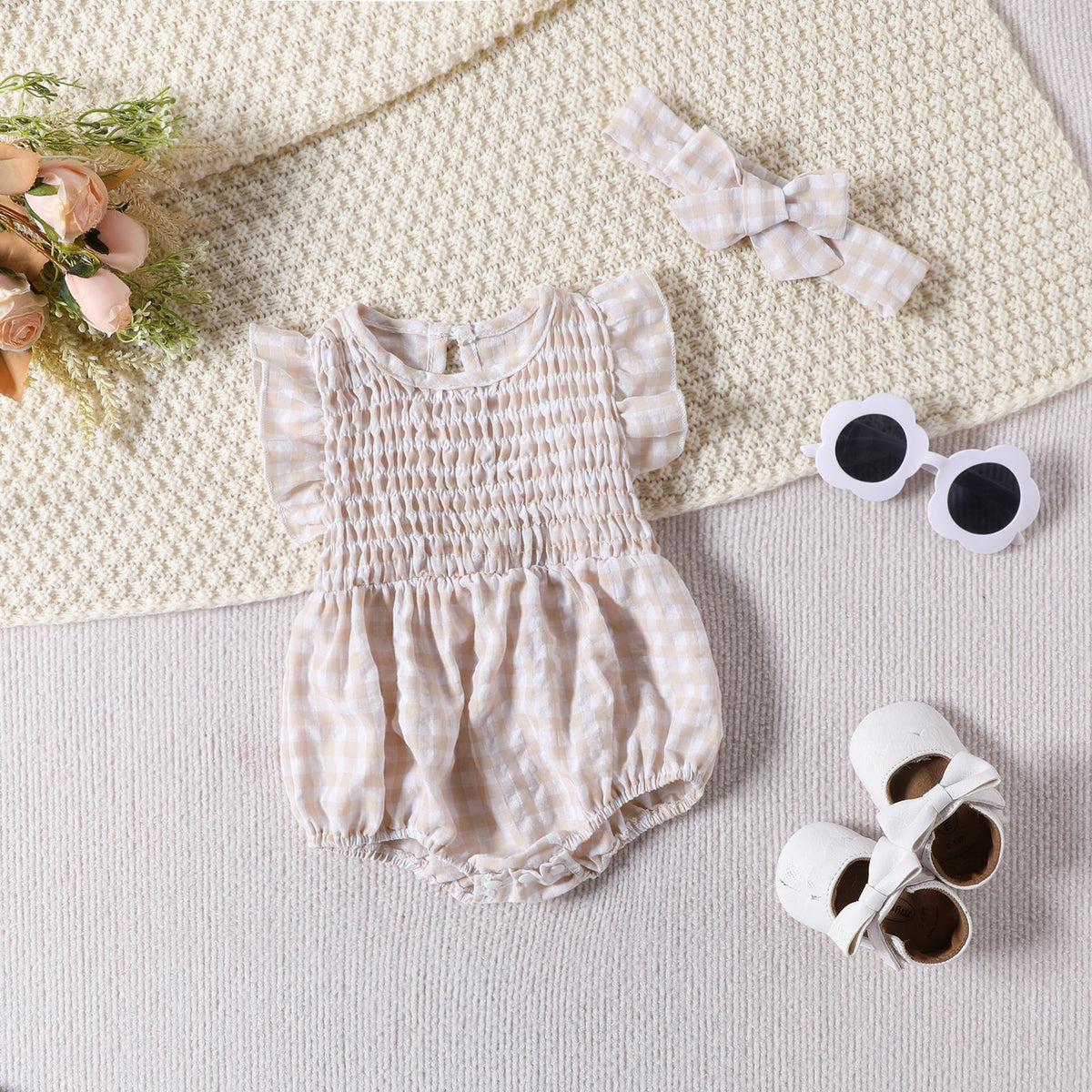 Blue Cozy Cub baby girl sleeveless romper with solid color and triangle bodysuit design, perfect for comfortable, stylish wear.