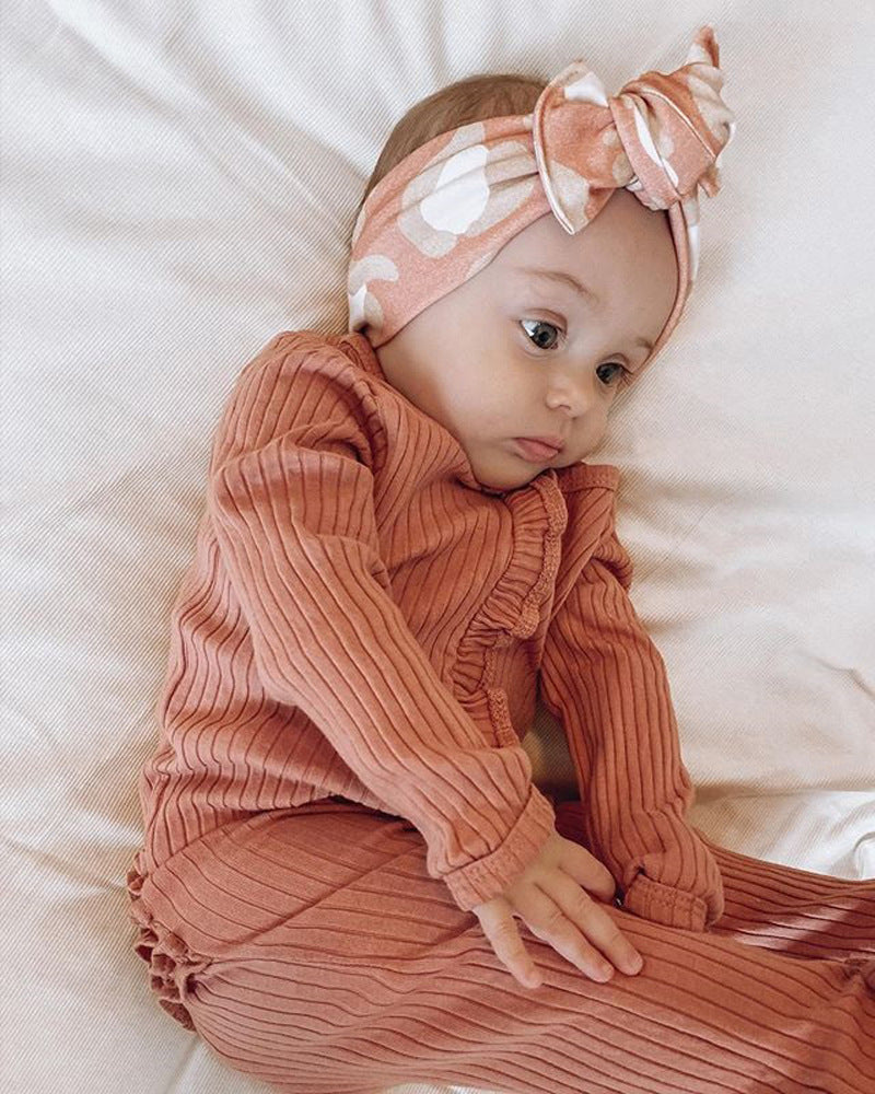 Orange Cozy Cub baby long sleeve romper, soft cotton one-piece for crawling and warmth during autumn and winter.
