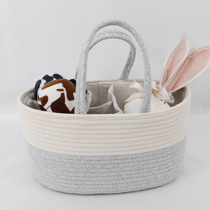 Cozy Cub Cotton Rope Diaper Caddy Organizer on nursery changing table, featuring soft cotton rope handle and spacious storage basket.