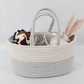Cozy Cub Cotton Rope Diaper Caddy Organizer on nursery changing table, featuring soft cotton rope handle and spacious storage basket.