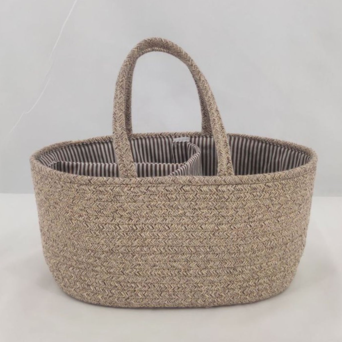 Cozy Cub Cotton Rope Diaper Caddy Organizer for nursery, featuring multiple compartments for baby essentials on changing table.