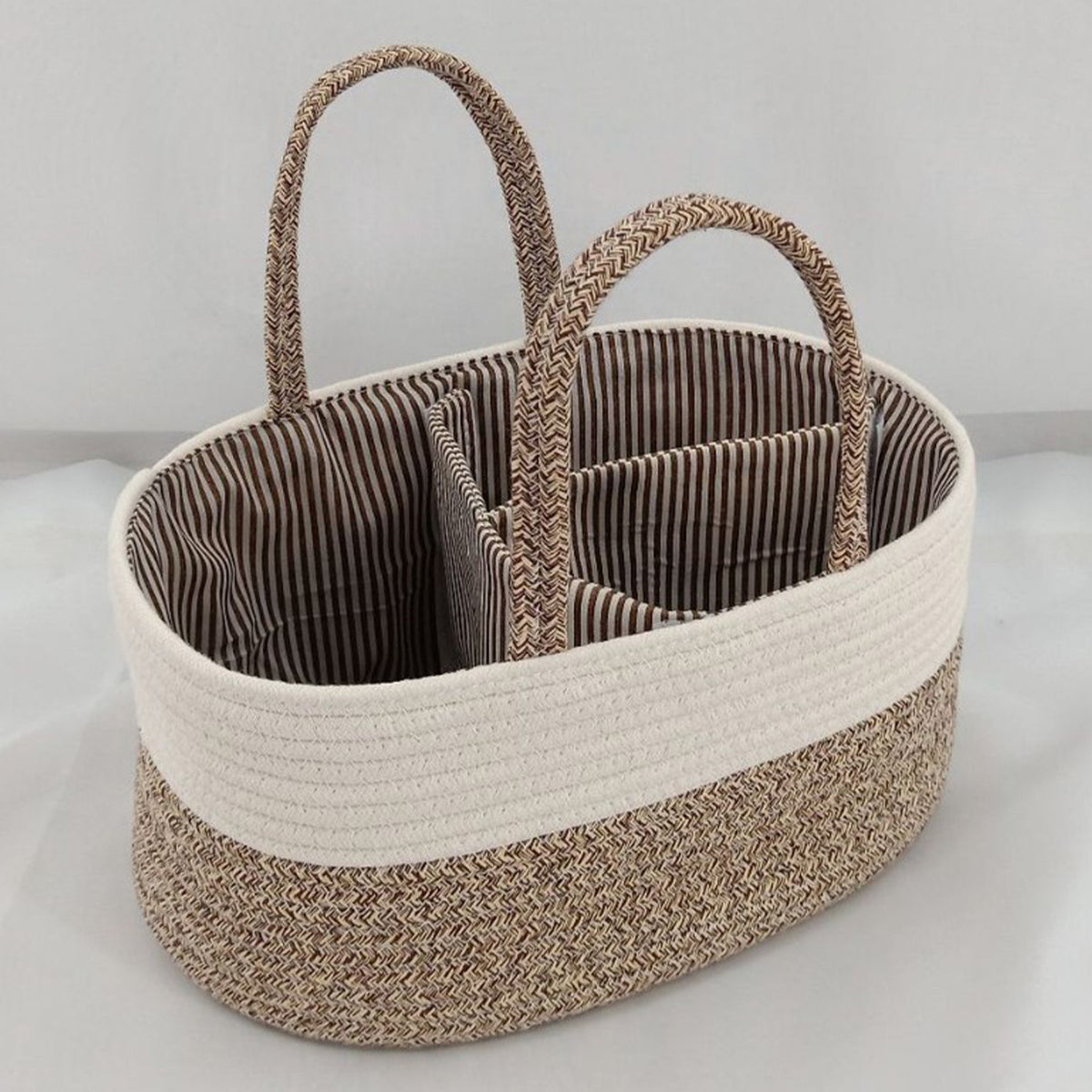 Cozy Cub Cotton Rope Diaper Caddy Organizer on nursery changing table, featuring soft cotton rope construction for nursery storage.