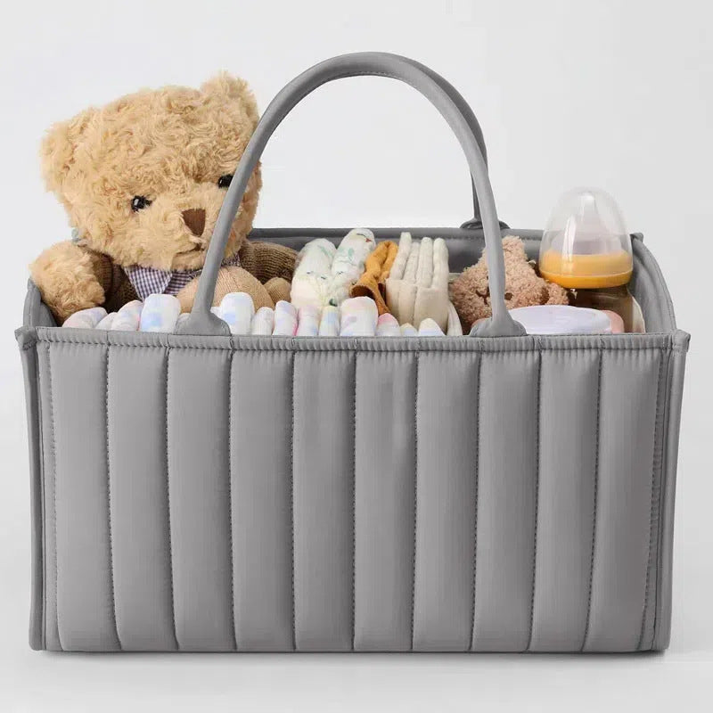 Cozy Cub stylish green diaper caddy storage basket for newborn essentials, featuring a practical organizer design.
