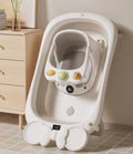 Cozy Cub baby bath seat with non-slip suction cups and temperature display, designed for safe, comfortable bathing.