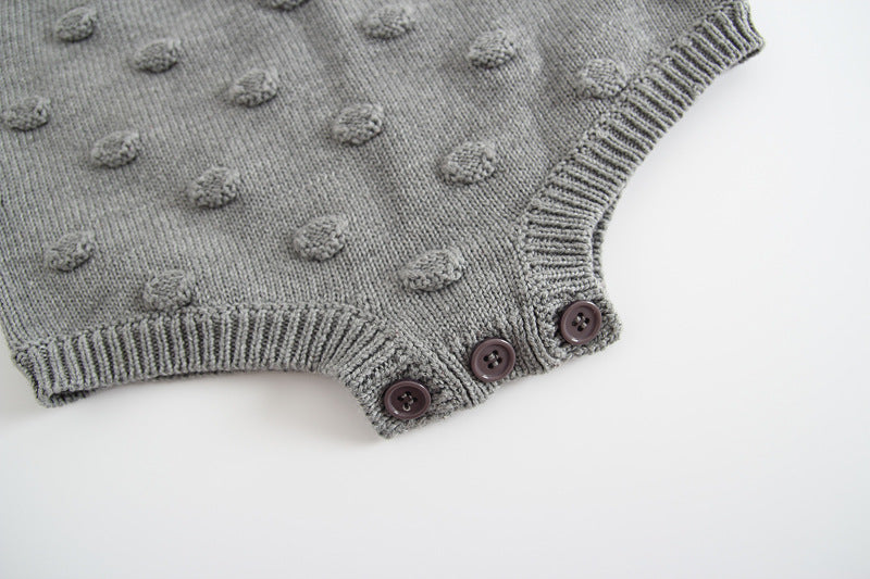 Gray knitted baby sweater romper from Cozy Cub, cozy warm one-piece apparel for infants, featuring soft knit fabric and comfortable fit.