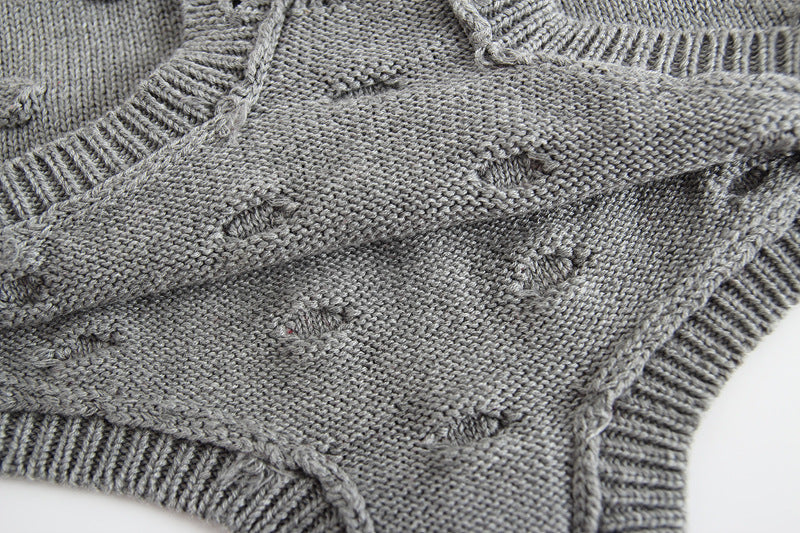Gray knitted baby sweater romper by Cozy Cub, cozy warm one-piece apparel for infants, featuring a soft, textured knit design.