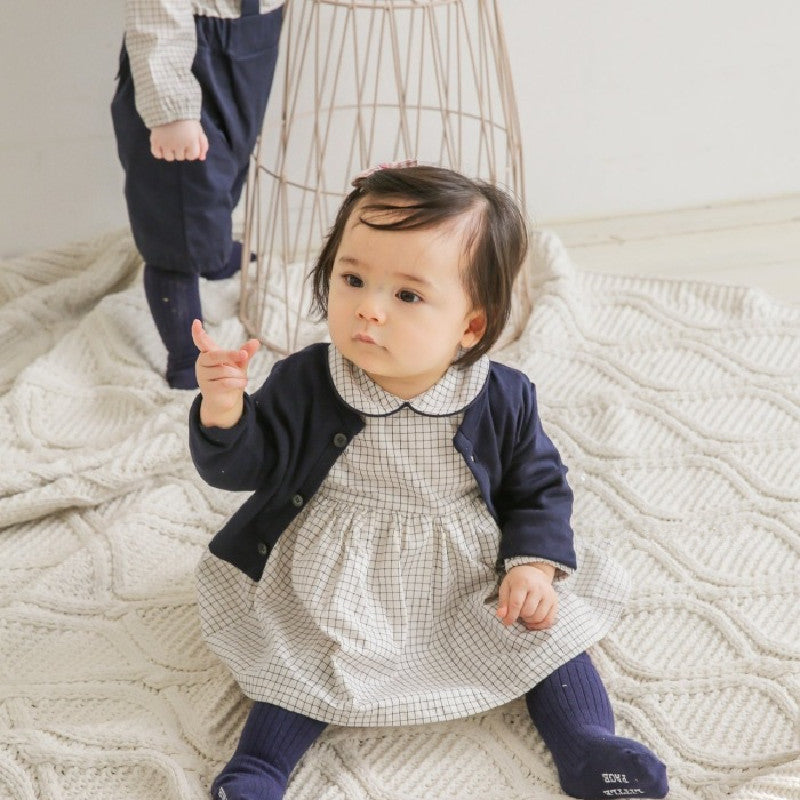 Cozy Cub baby romper jumpsuit in soft fabric, featuring long sleeves and snap closures for comfortable everyday wear.