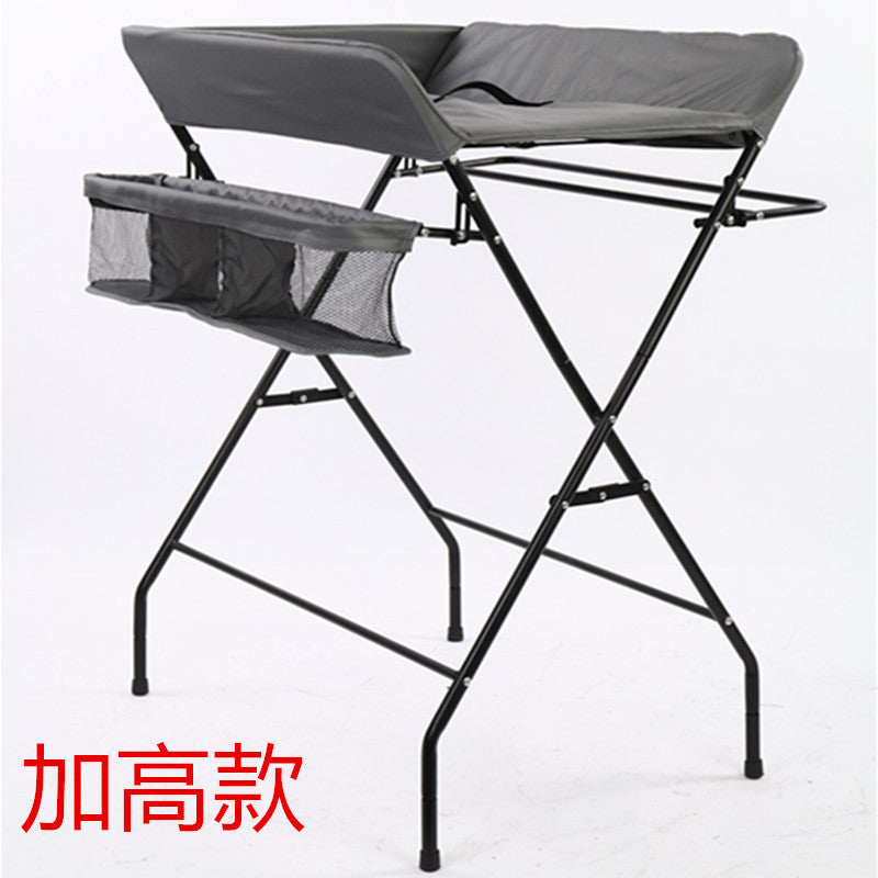 Dark grey Cozy Cub foldable baby diaper changing table, portable and compact baby furniture for easy diaper changes.