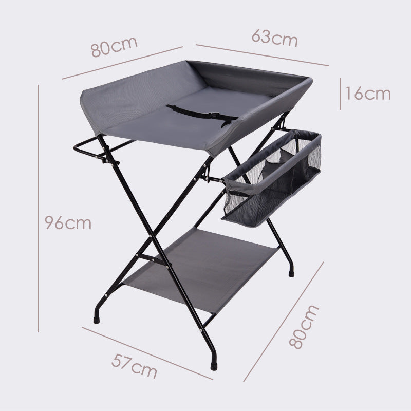 Dark grey Cozy Cub foldable baby diaper changing table, portable and compact baby furniture for easy diaper changes.