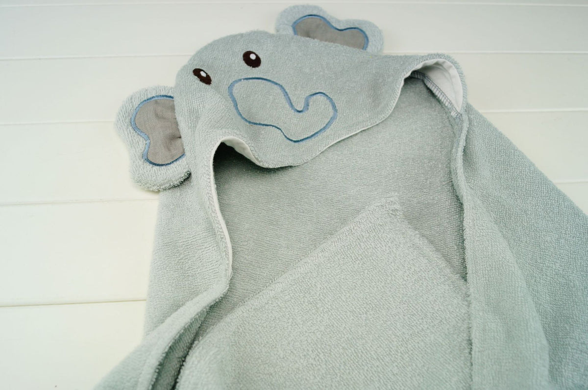 Cozy Cub baby hooded bath towel with elephant design, soft wrap blanket for newborns, perfect for bath time comfort and warmth.