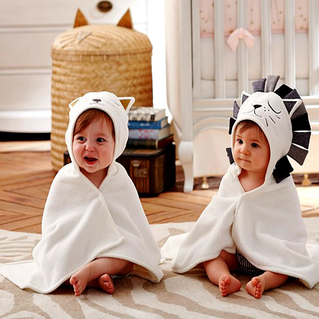 Cozy Cub baby hooded animal towel featuring a lion design, soft bath wrap for infants with a cute animal hooded top.