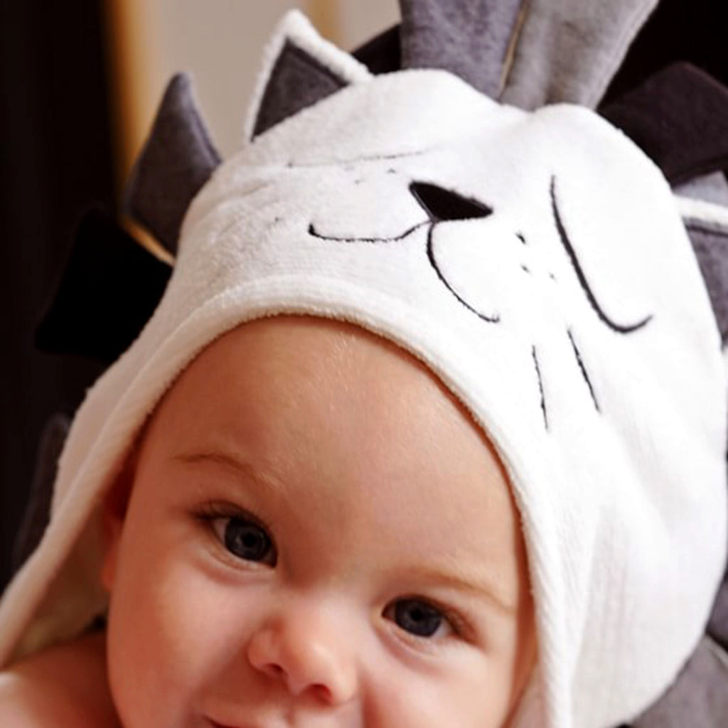 Cozy Cub baby hooded animal towel featuring a lion and cat design, soft bath wrap for infants, made for cozy bath time.
