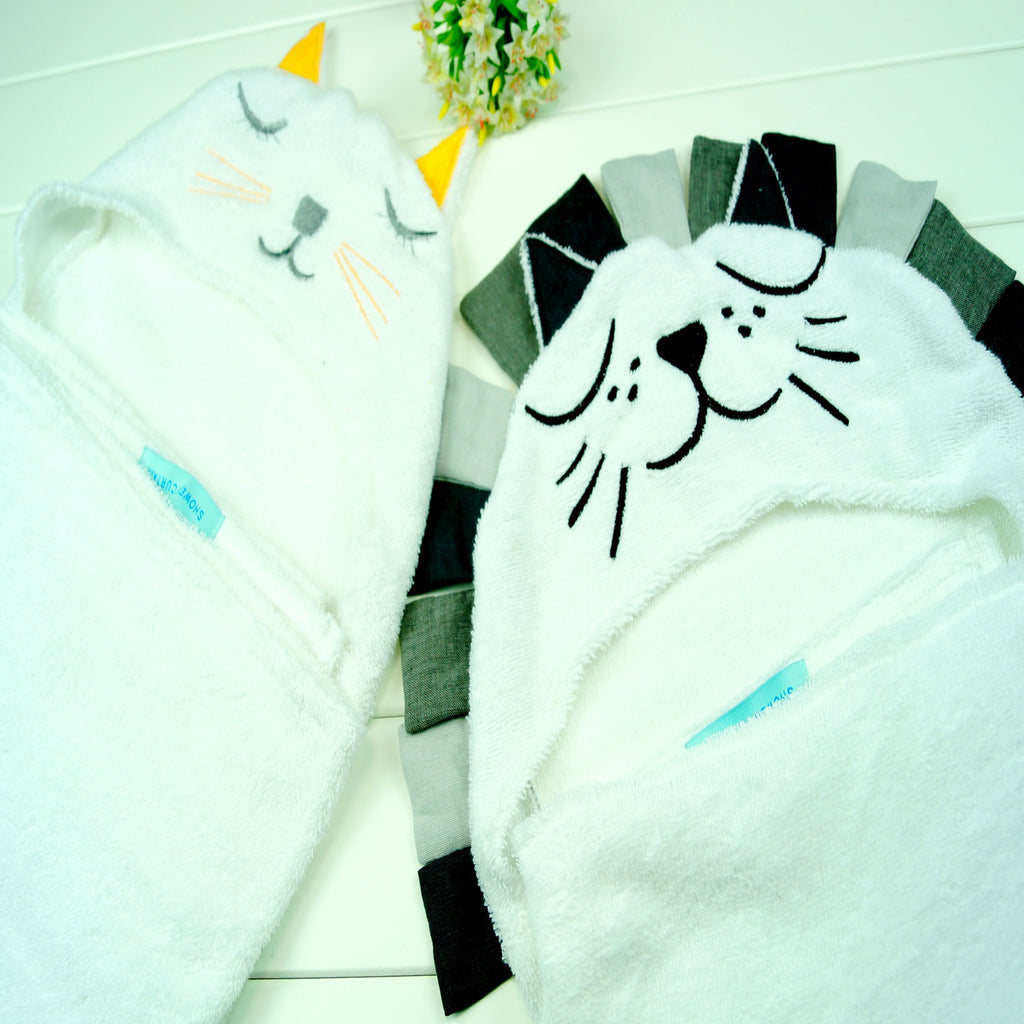 Cozy Cub baby hooded animal towel featuring a lion design, soft bath wrap for infants, with a hood and animal face detail.