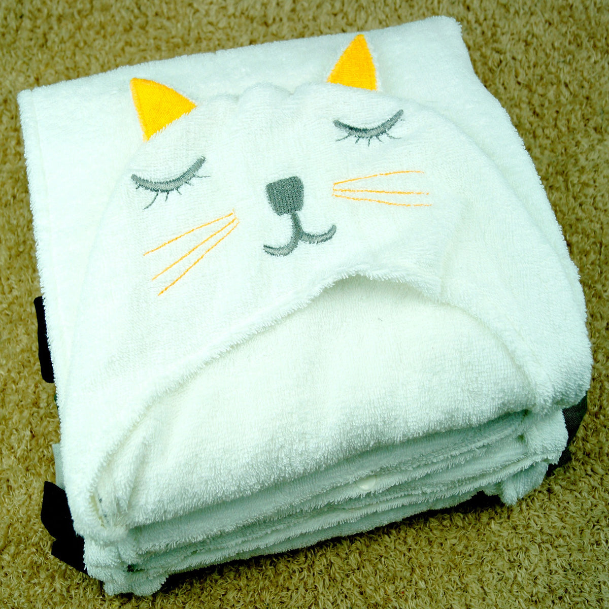 Cozy Cub baby hooded animal towel featuring a lion design, soft bath wrap for infants, made for comfortable drying after bath time.