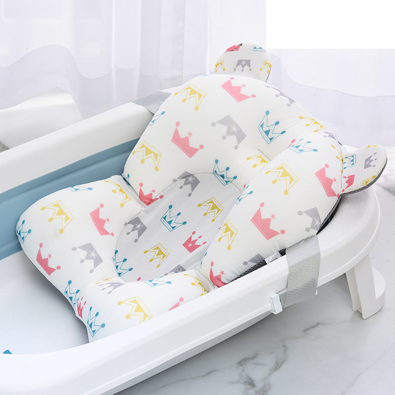 Orange Cozy Cub baby bath mat with non-slip surface, designed for infant tubs and safety during bath time.