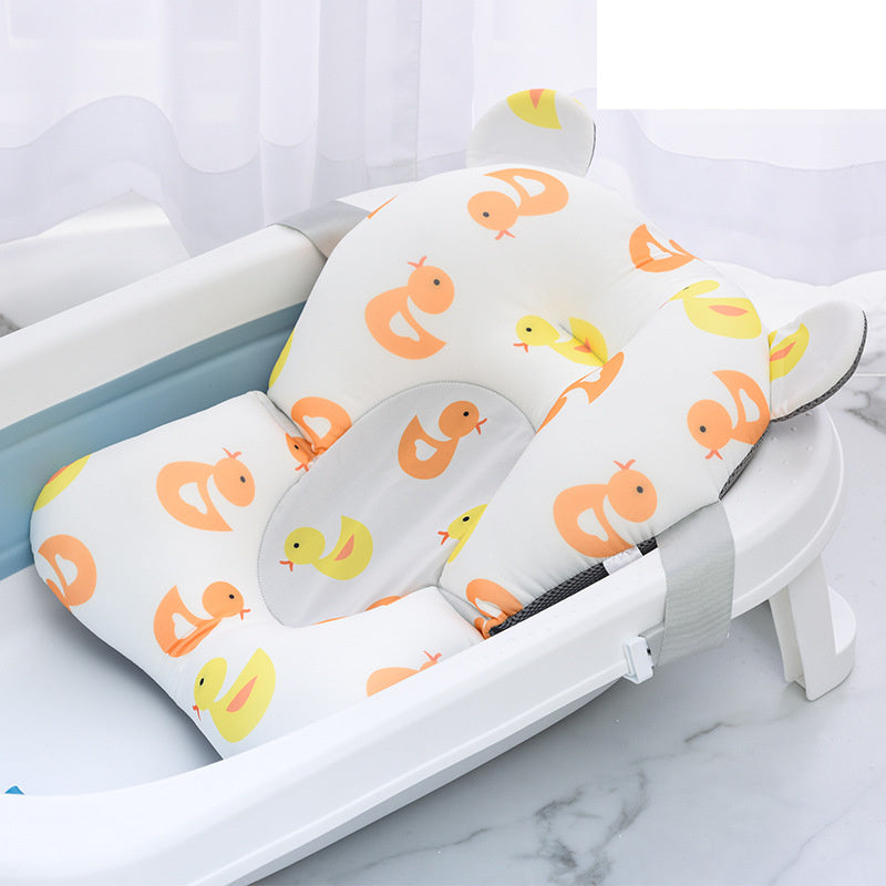 Orange Cozy Cub baby bath mat with non-slip safety surface for infant tubs, designed to keep babies secure during bath time.