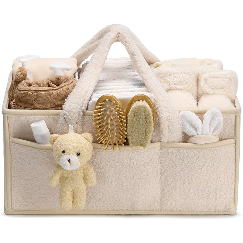 Green Cozy Cub diaper caddy organizer for nursery, with compartments for changing table storage and diaper accessories.