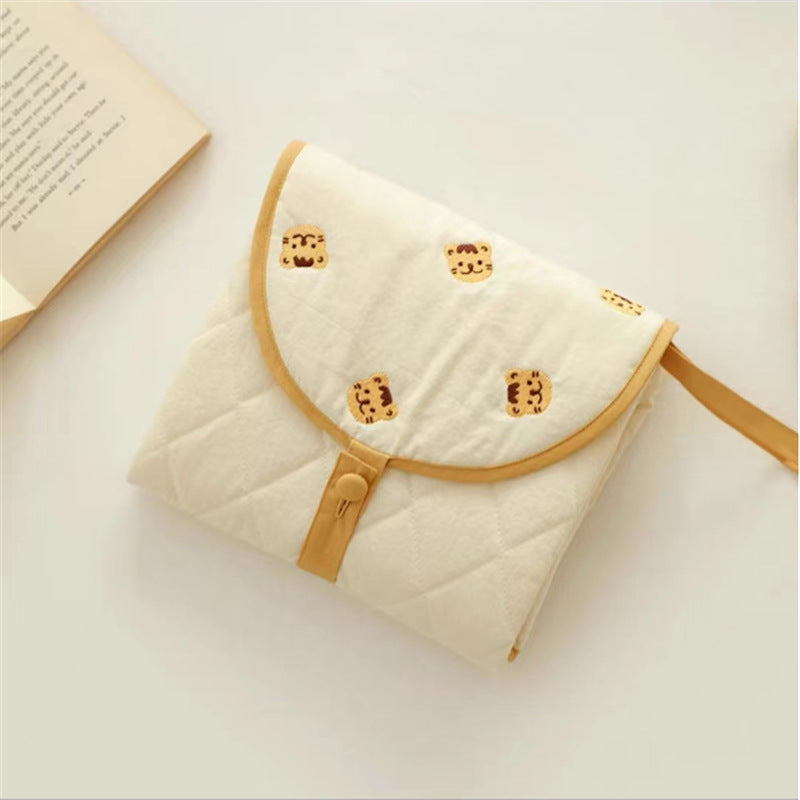 Cozy Cub portable baby diaper changing pad, foldable waterproof mat with bear design, 50x70cm, for on-the-go diaper changes.