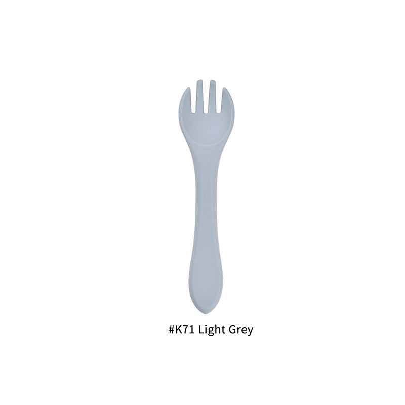 Cozy Cub baby silicone feeding fork in army green, food grade infant utensil designed for safe and easy feeding.