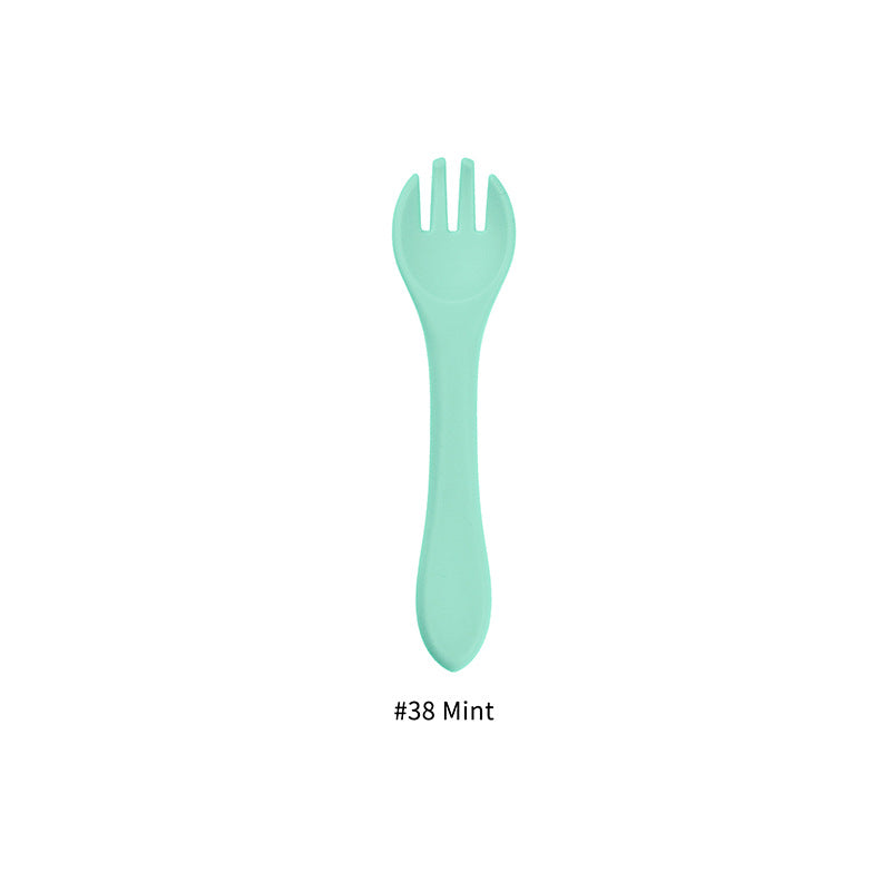 Cozy Cub baby silicone feeding fork in army green, food-grade infant utensil designed for safe, easy feeding.