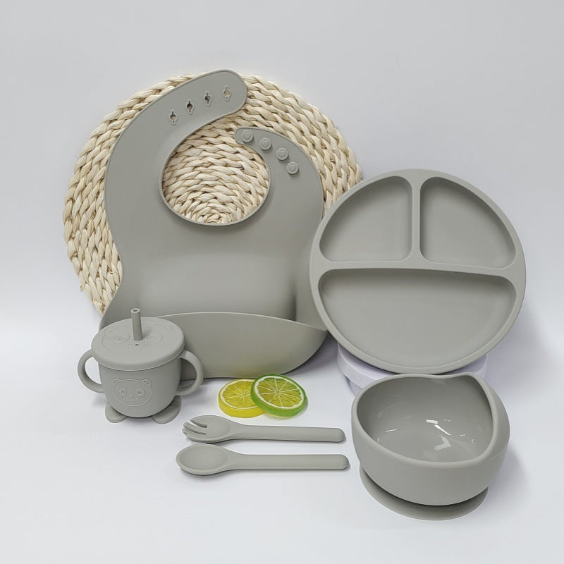 Beige Cozy Cub baby silicone feeding placemat and tableware set with suction base for secure feeding and easy cleanup.