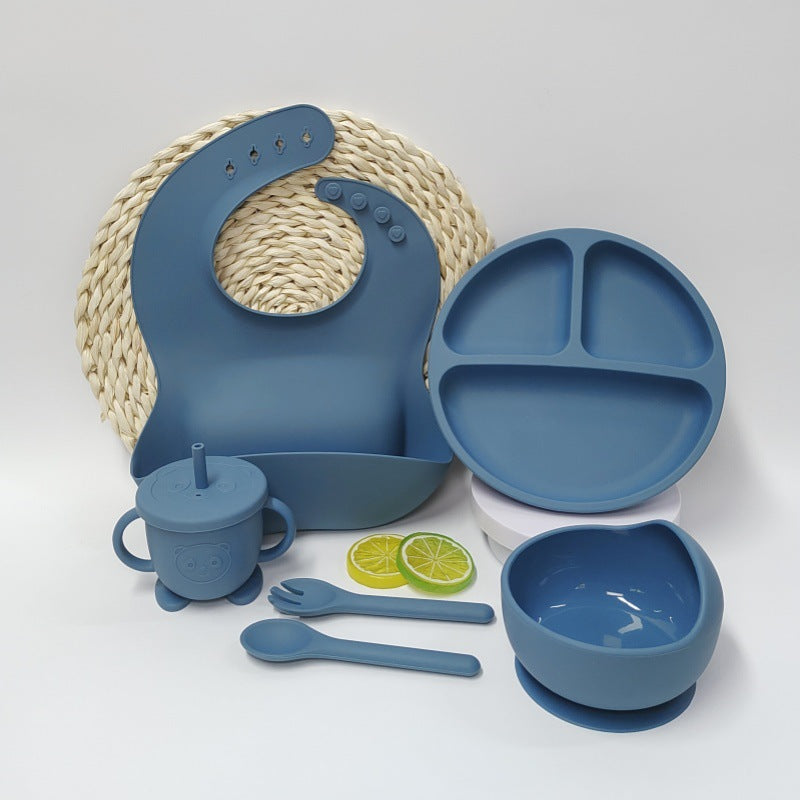 Beige Cozy Cub silicone baby placemat and tableware set with suction base, designed for feeding and easy cleanup.