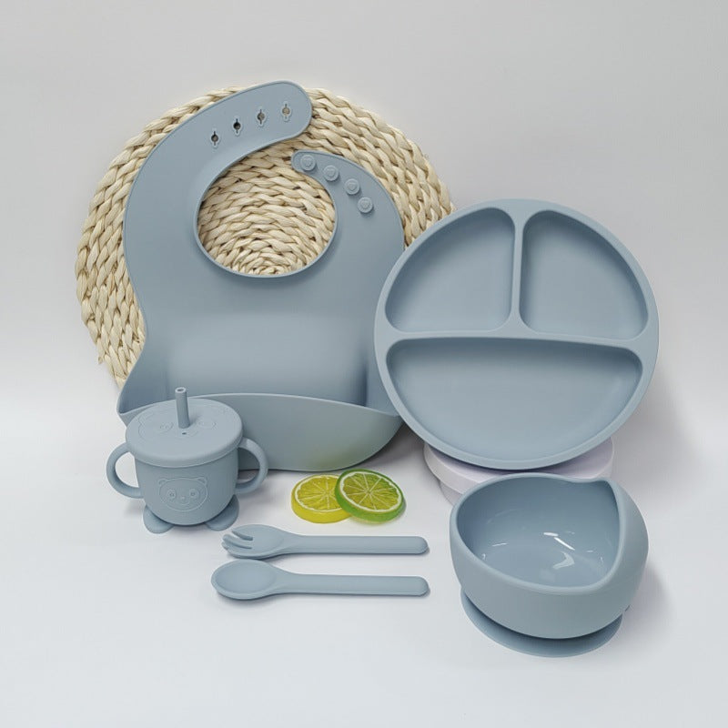 Cozy Cub beige silicone baby placemat and tableware set with suction cup, ideal for feeding and mealtime safety.