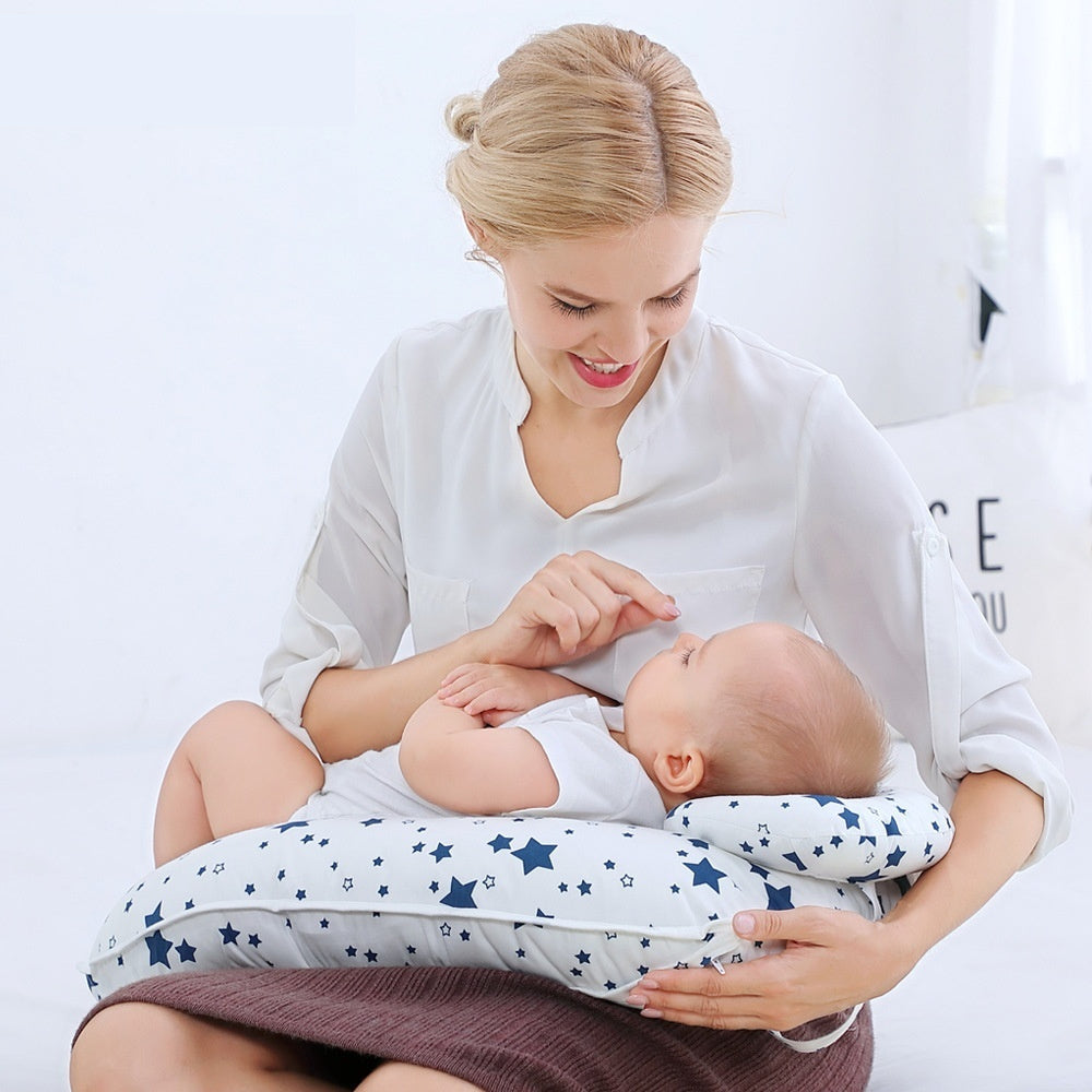 Blue Cozy Cub U-shape nursing pillow for breastfeeding support, designed for comfort and adjustable fit for mothers.
