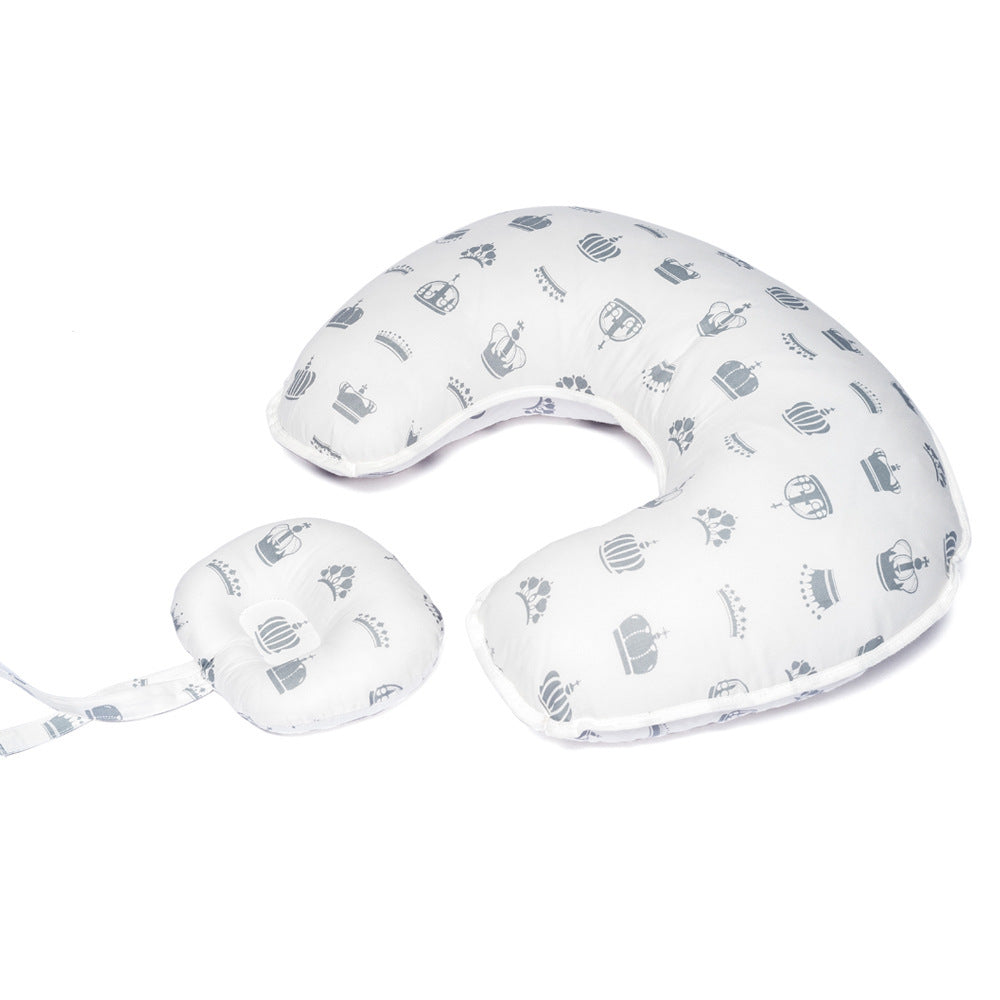 Blue Cozy Cub nursing pillow in U-shape designed for breastfeeding support for mothers, with star pattern for comfortable feeding.