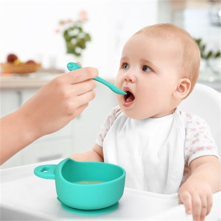 Cozy Cub baby feeding set with green silicone bowl and spoon, food-grade 3-piece set for infants and toddlers.