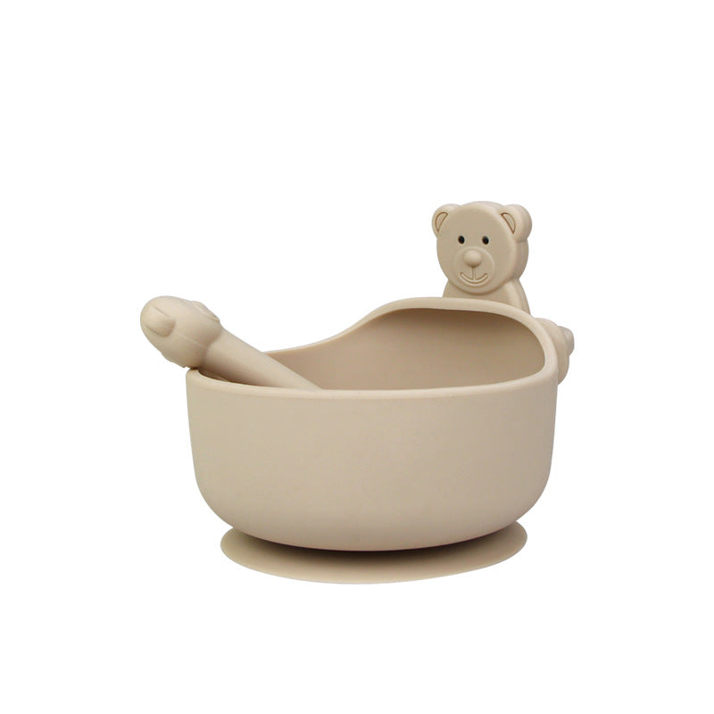 Cozy Cub baby feeding set with green silicone bowl and spoon, made from food-grade, durable silicone for toddlers.