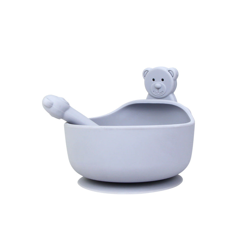 Cozy Cub baby feeding set with green silicone bowl and spoon, 3-piece food-grade silicone feeding set for infants.