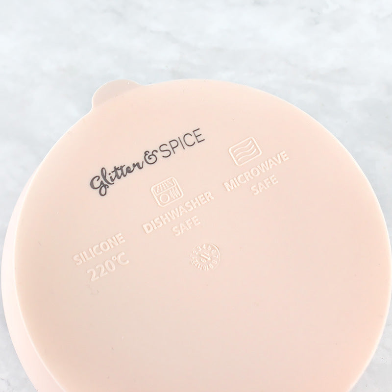 Light pink Cozy Cub silicone suction bowl set for babies, ideal for feeding and complementary food dishes.