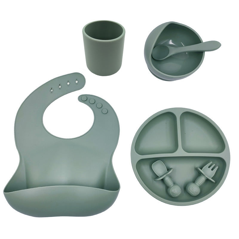 Cozy Cub baby feeding set with silicone bib, cup, and spoon, designed for baby self-feeding and mealtime convenience.
