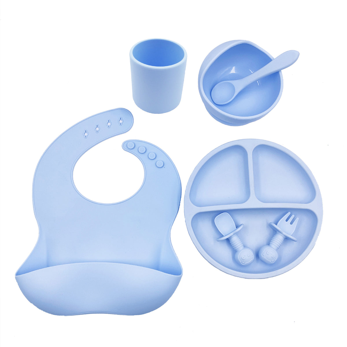 Cozy Cub baby feeding set with orange silicone bib, cup, and spoon designed for young children.
