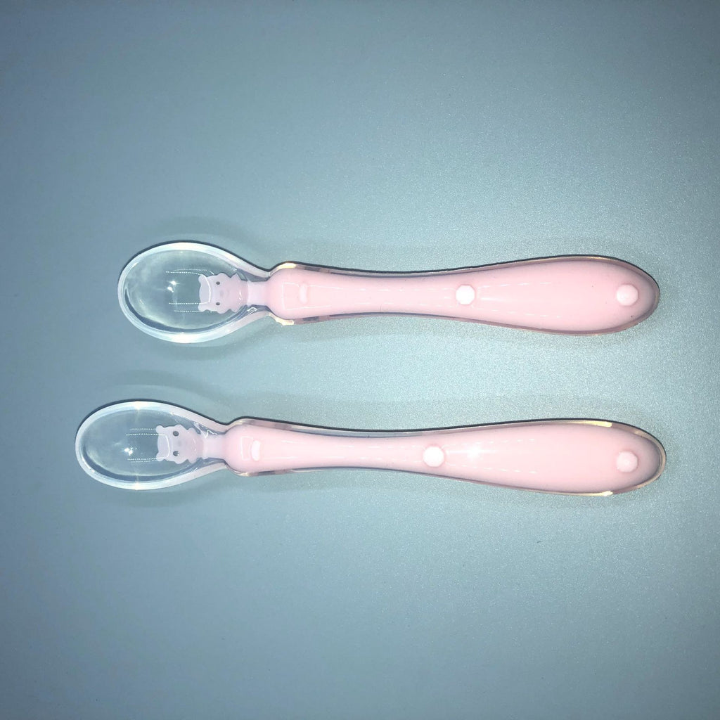 Pink Cozy Cub baby silicone spoon for soft infant feeding, designed for gentle feeding and easy handling.