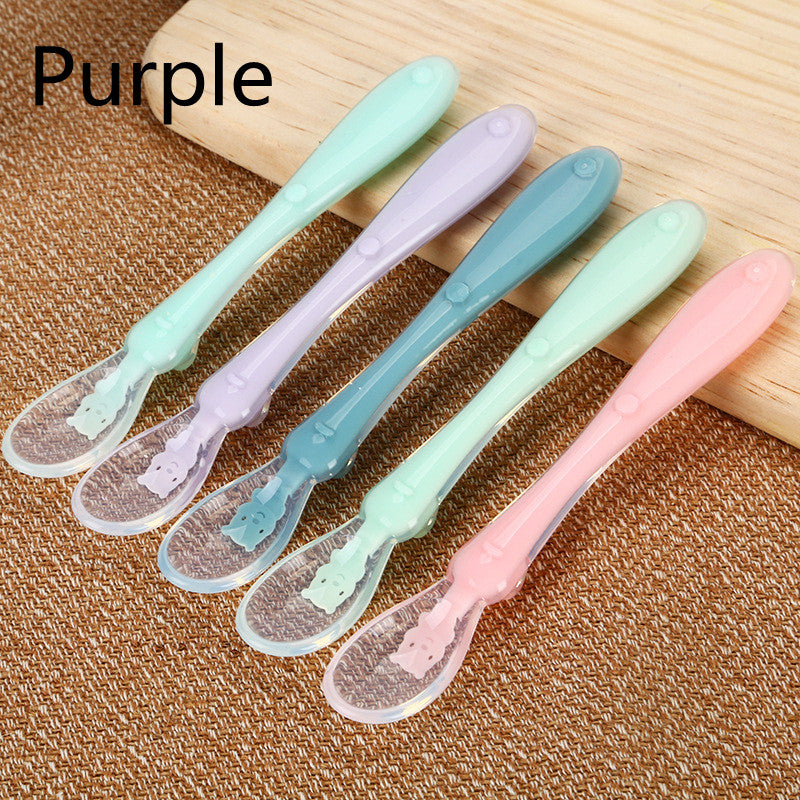 Pink Cozy Cub baby silicone spoon, soft infant feeding tableware designed for gentle feeding and easy handling.