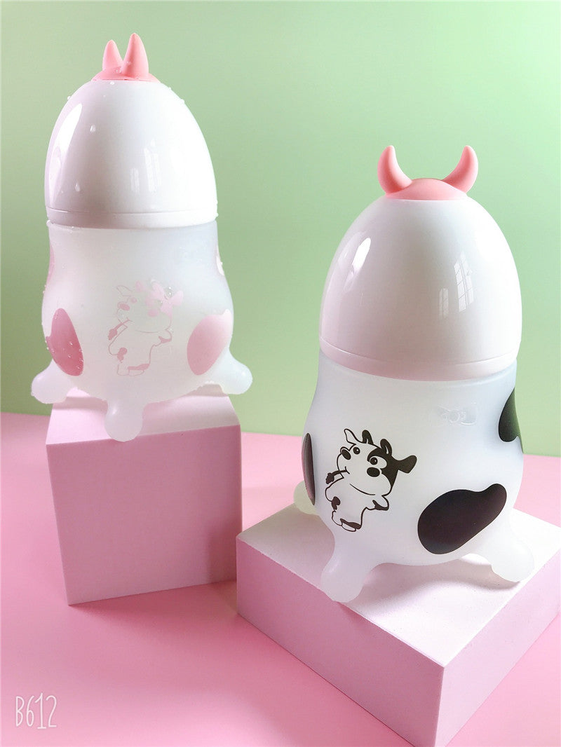 Pink Cozy Cub Wide Neck Baby Bottle with soft silicone feeding bottle for infants, featuring a comfortable wide neck design.