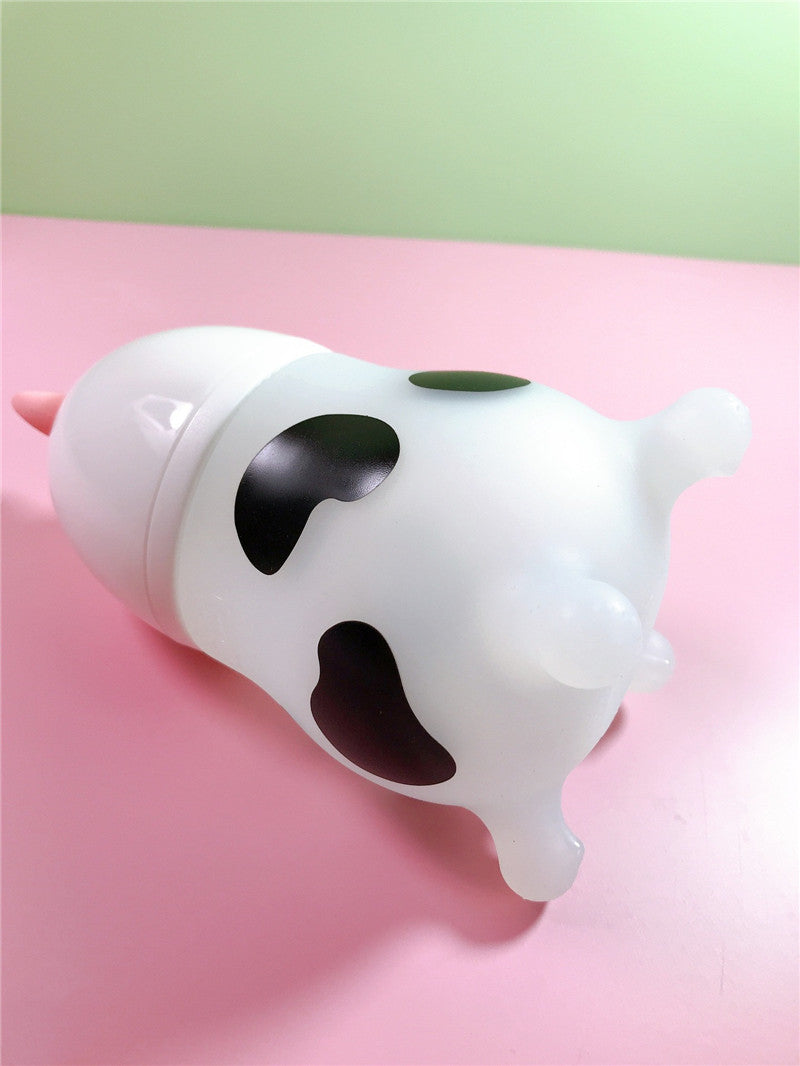 Pink Cozy Cub Wide Neck Baby Bottle made of soft silicone, designed for comfortable feeding and easy grip.