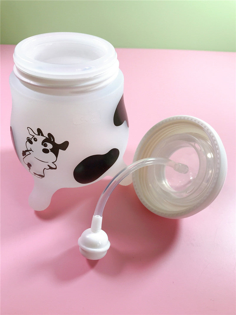 Pink Cozy Cub Wide Neck Baby Bottle with soft silicone feeding nipple, designed for easy feeding and comfortable grip.