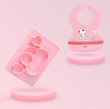 Pink Cozy Cub cartoon suction bowl for infants, silicone feeding dish with a playful design, ideal for easy feeding and learning.