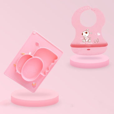 Pink Cozy Cub cartoon silicone suction bowl for infants, designed as a learning feeding dish with a colorful, playful pattern.