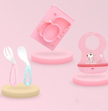 Pink Cozy Cub cartoon suction bowl made of silicone, designed for infants' feeding and learning, featuring a fun cartoon design.