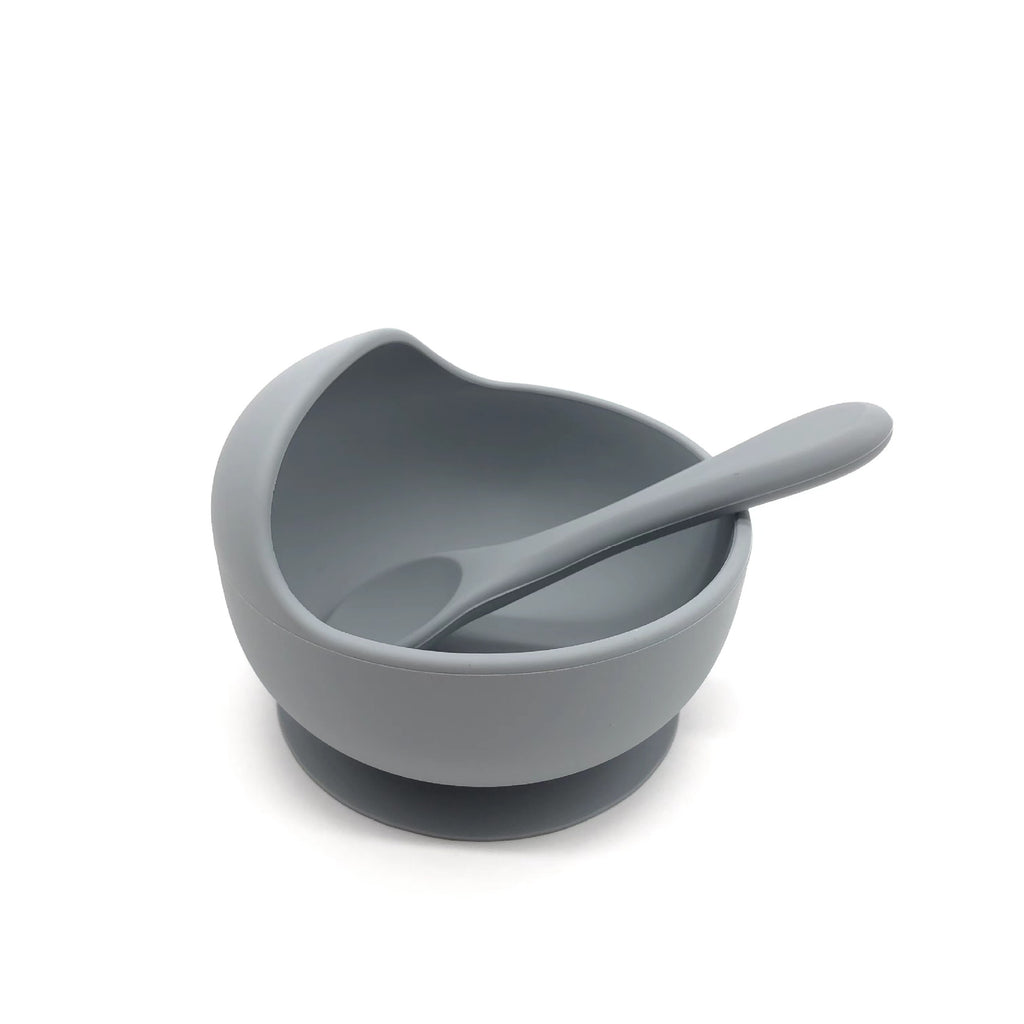 Cozy Cub baby silicone feeding bowl with non-slip suction cup, purple color, designed for safe, easy feeding.