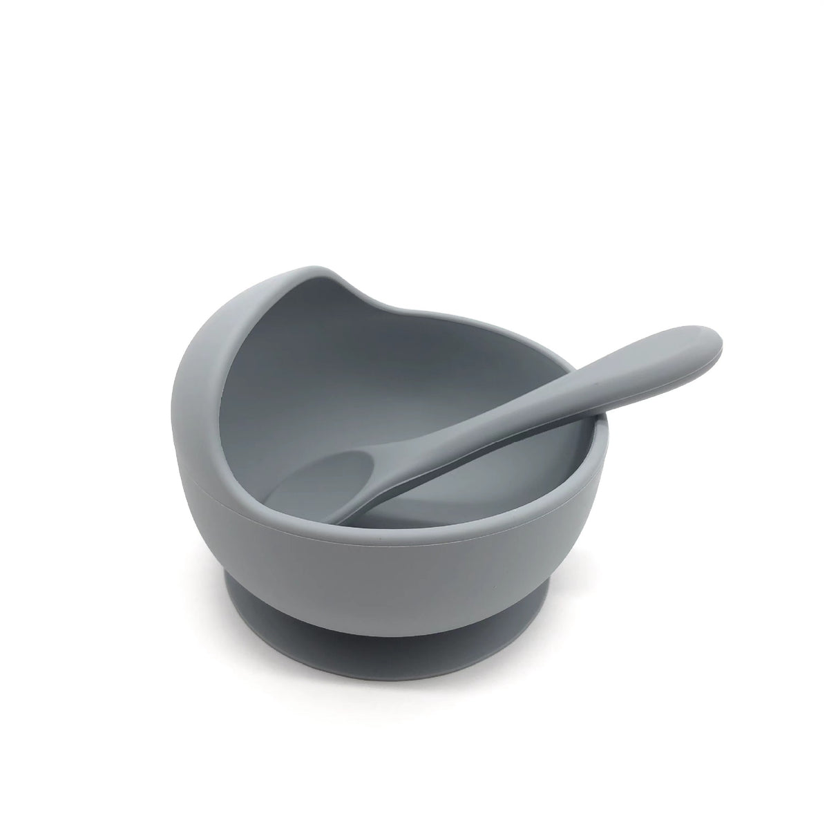 Cozy Cub baby silicone feeding bowl with non-slip suction cup, purple color, designed for safe, easy feeding.