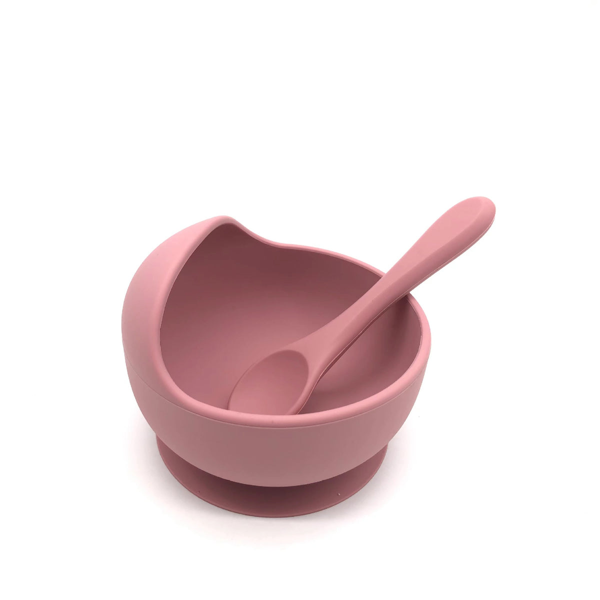 Cozy Cub baby silicone feeding bowl with non-slip suction cup, purple color, designed for safe, easy feeding for infants.