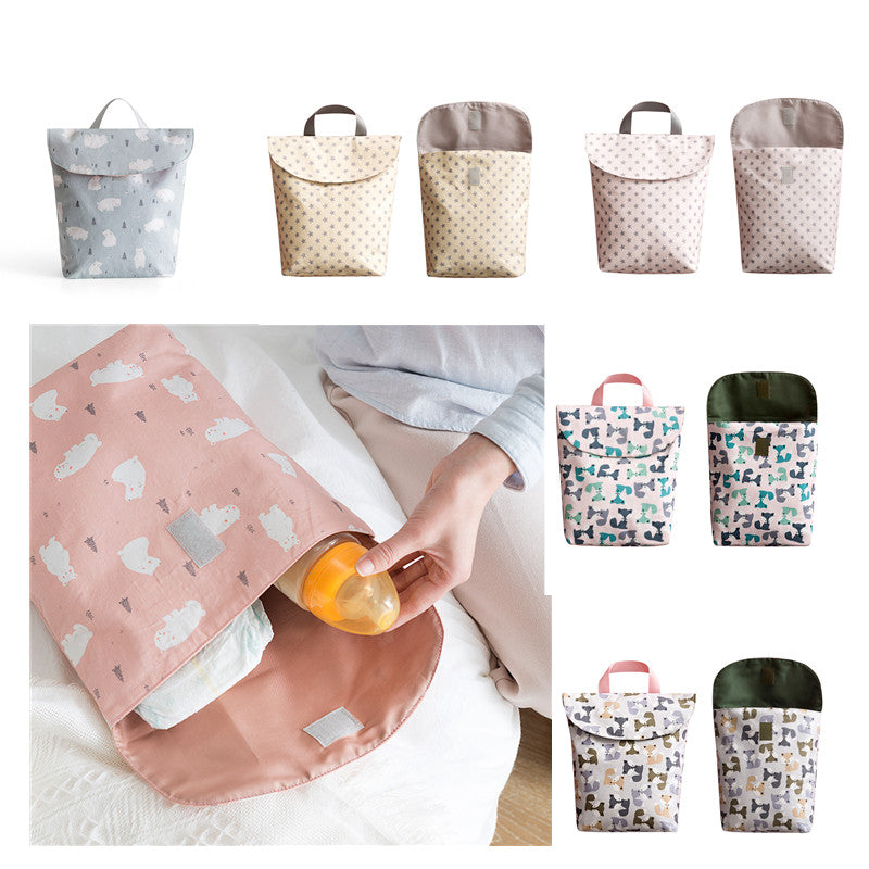 Cozy Cub baby diaper storage bag in grey with a cute fox design, portable nursery organizer for on-the-go parents.