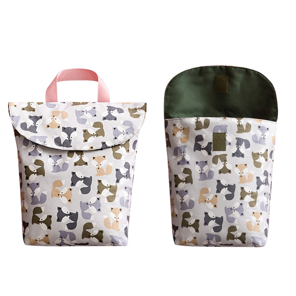 Grey Cozy Cub nursery diaper storage bag with fox design, portable organizer for on-the-go parents and baby essentials.