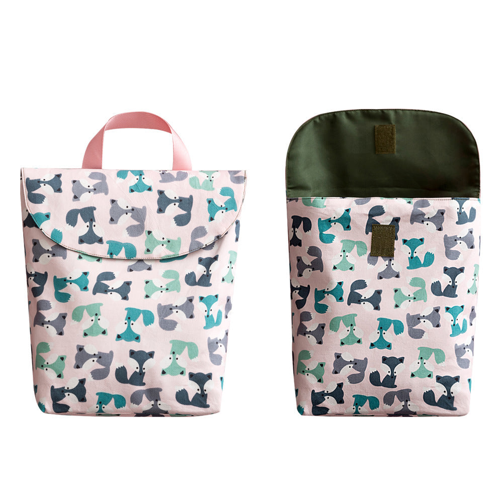 Cozy Cub nursery grey baby diaper storage bag, portable organizer for on-the-go parents, with a cute fox design and compact shape.